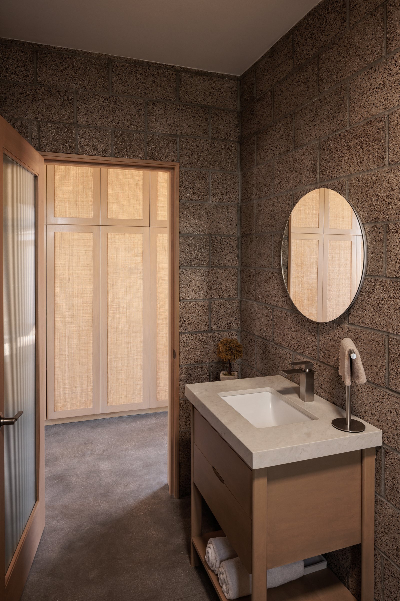 ADU Completed - Bathroom vanity with rattan closet doors