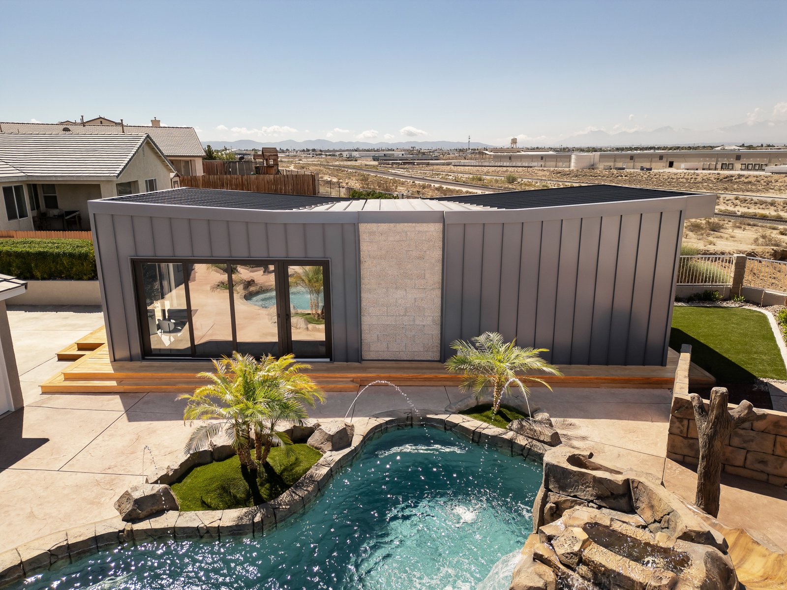ADU Completed - Dining area with pool view through sliding doors